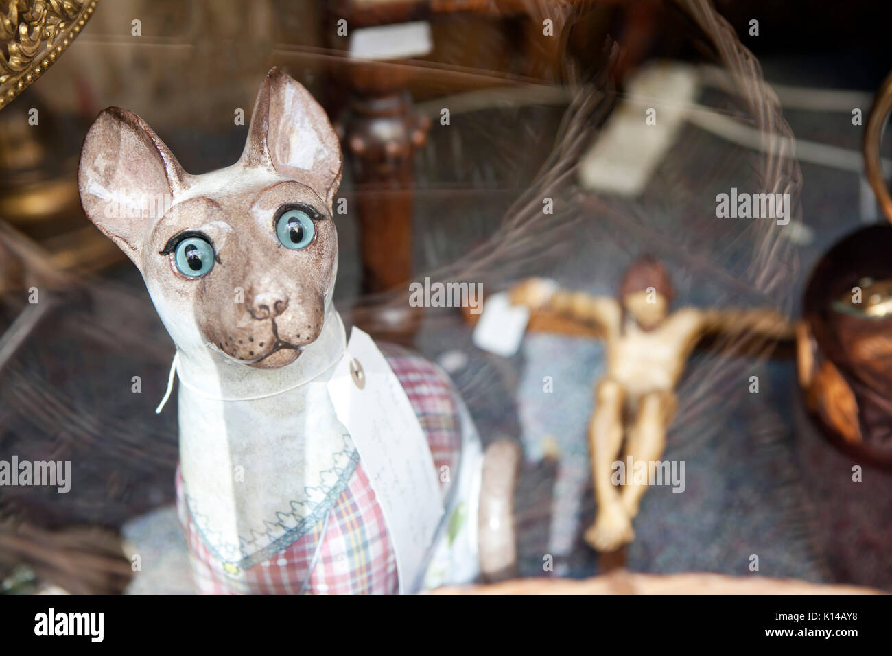 LONDON, ENGLAND - JULY 12, 2017 Ceramic cat in a shop window of an ...