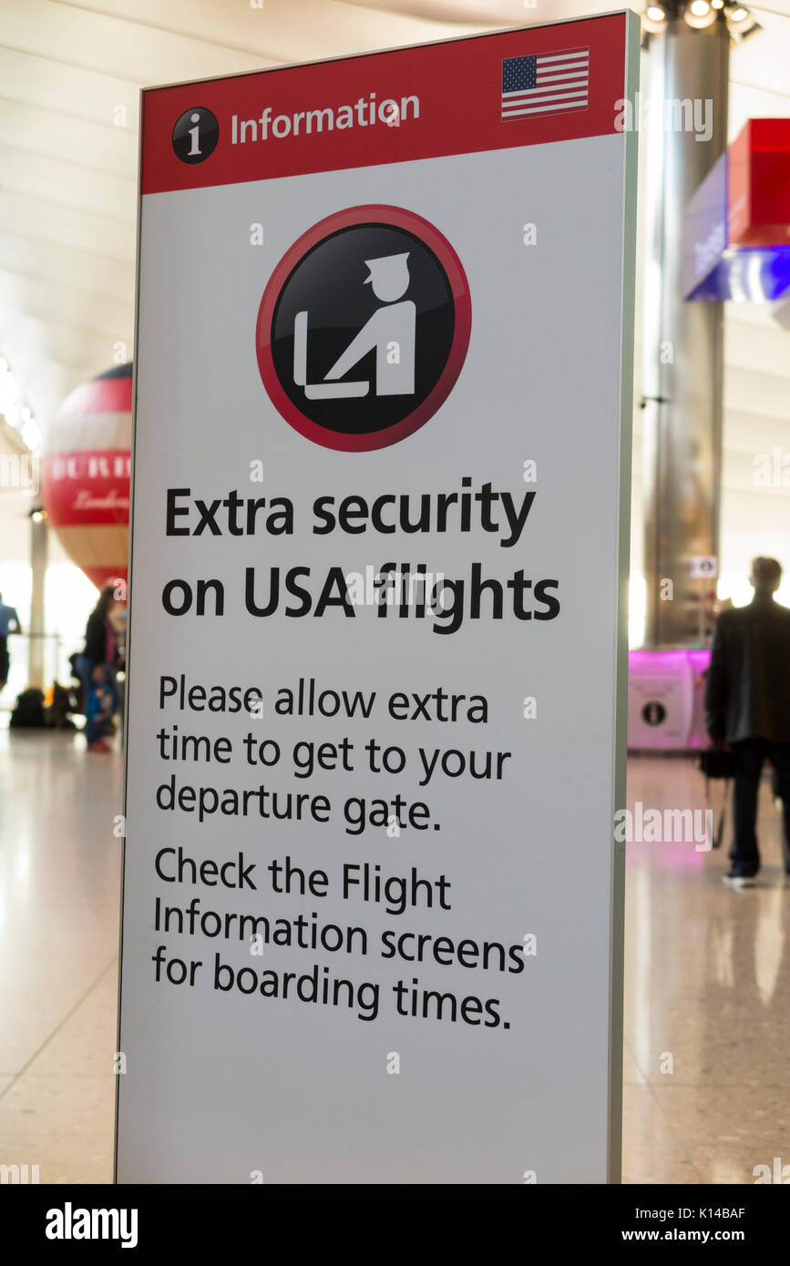 Warning sign at London Heathrow airport terminal two regarding extra security on flights to the USA / United States. London UK. (89) Stock Photo