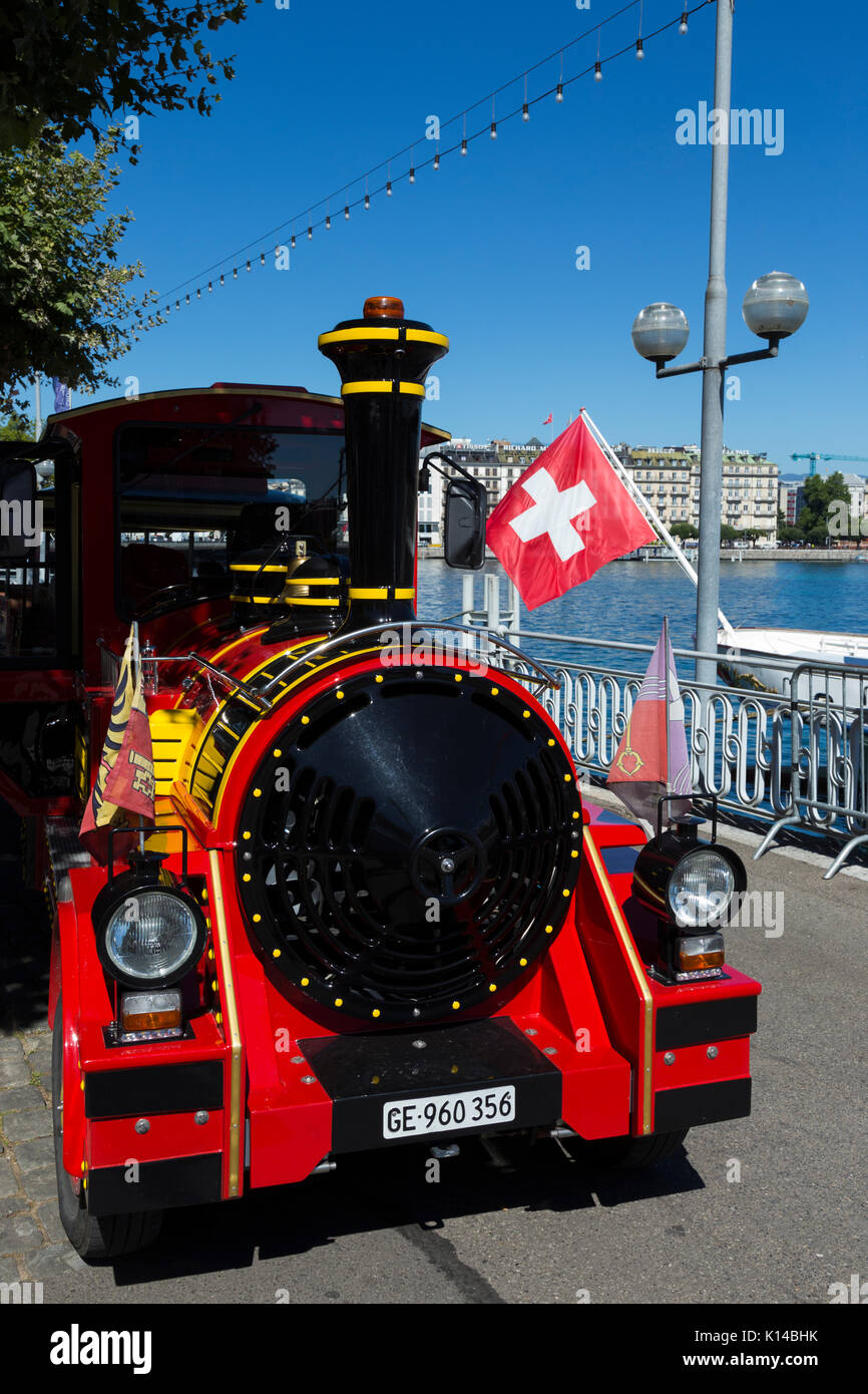 Setting off point at Jardin Anglais stop / quayside for a toy train ride for families and children beside Lake Geneva. Sunny summer day / blue skies. Stock Photo