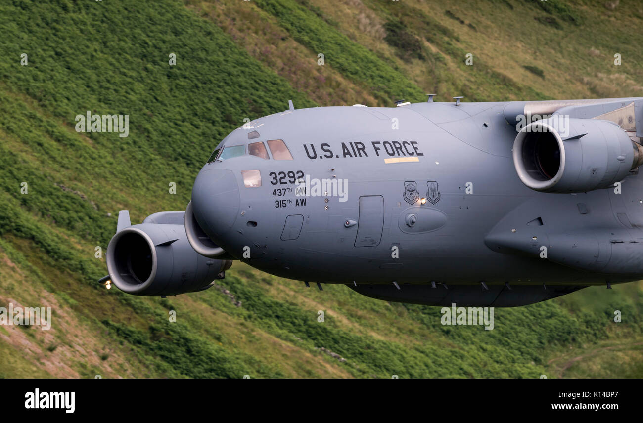 The USAF C-17 Globemaster 23292 from the Air Mobility Command made a first appearance for its aircraft type in the Mach Loop, Wales, UK (low Flying Ar Stock Photo