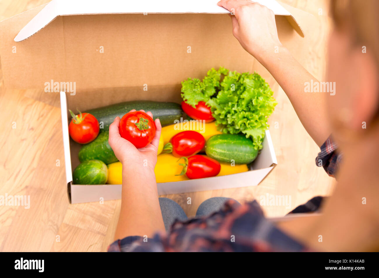 Box of fresh organic vegetables and fruits delivered to home online