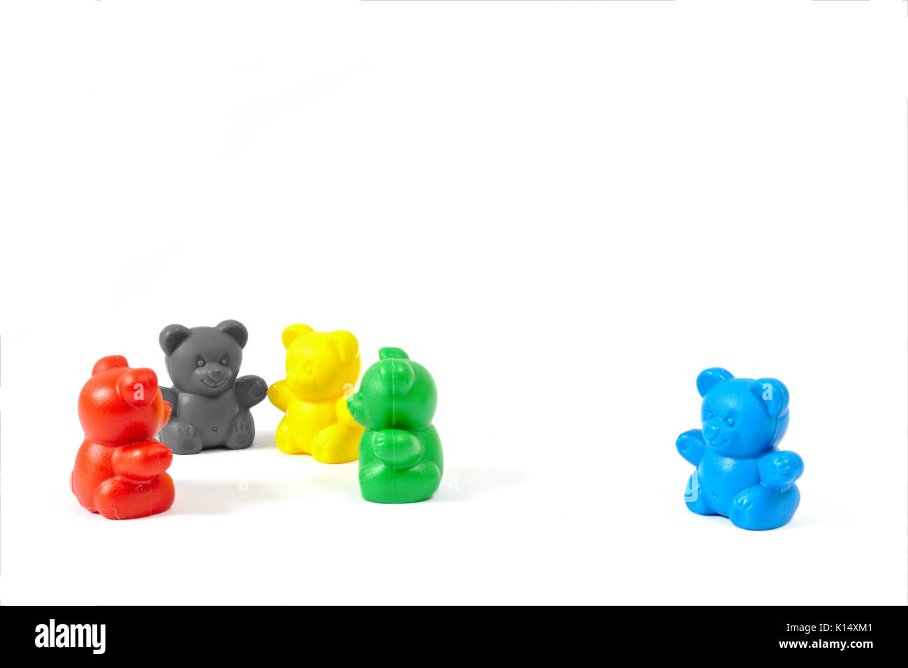 Plastic toy figures in the colors of the major political parties in Germany (AfD clearly isolated off to the side) isolated on white background Stock Photo