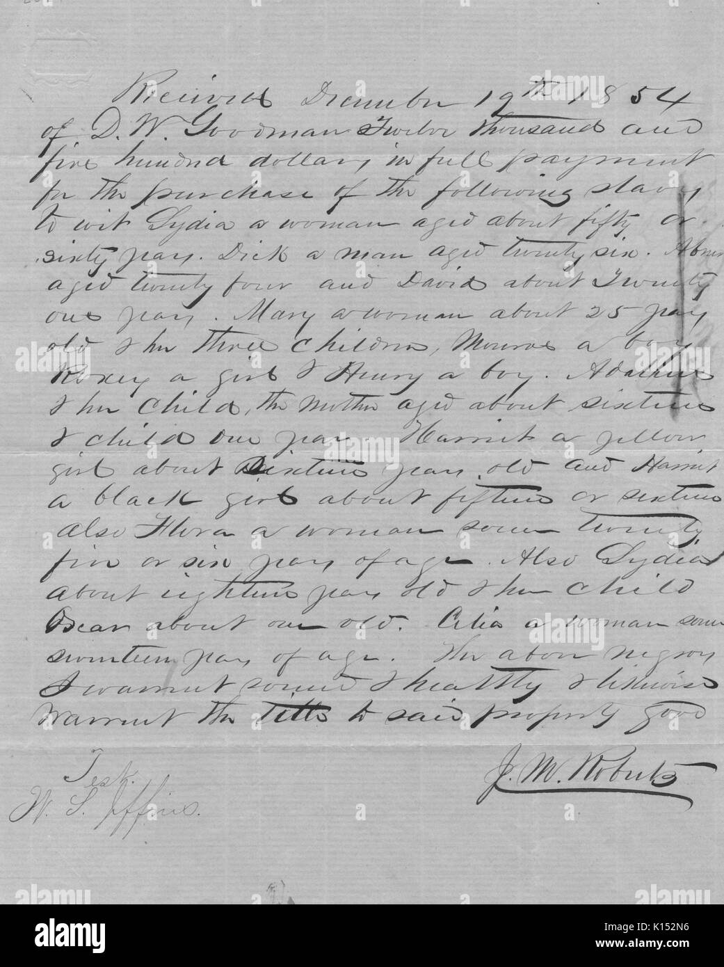 A hand written bill of sale for approximately twenty slaves for the sum of $12500, 1854. From the New York Public Library. Stock Photo
