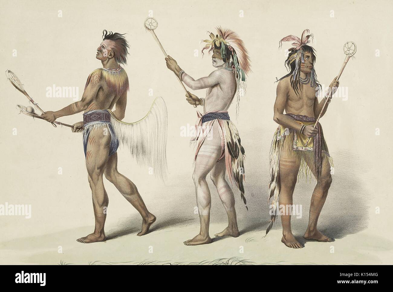Native Americans holding primitive lacrosse sticks and preparing to