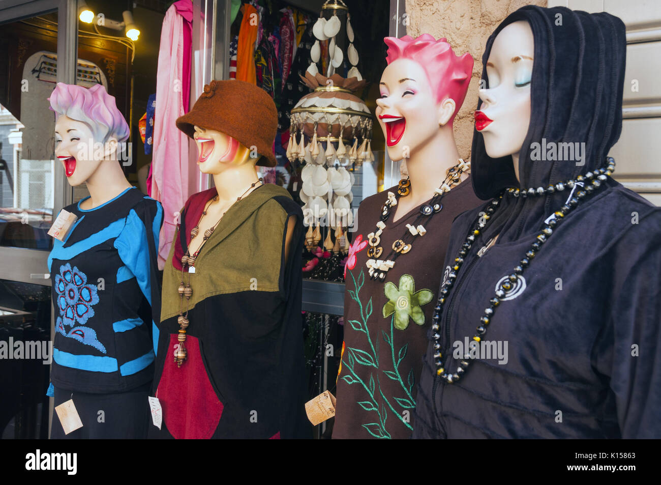 France, Corsica, Bastia, clothing store, humorous and colorful female mannequins in laughing poses Stock Photo