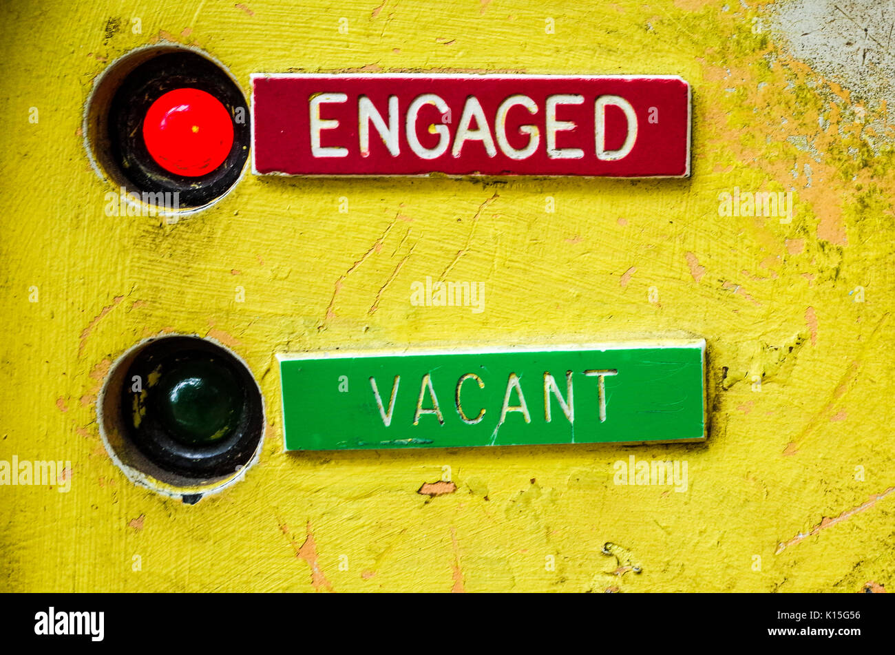 Engaged Vacant LED indicator sign on a public pay toilet in Cambridge UK Stock Photo