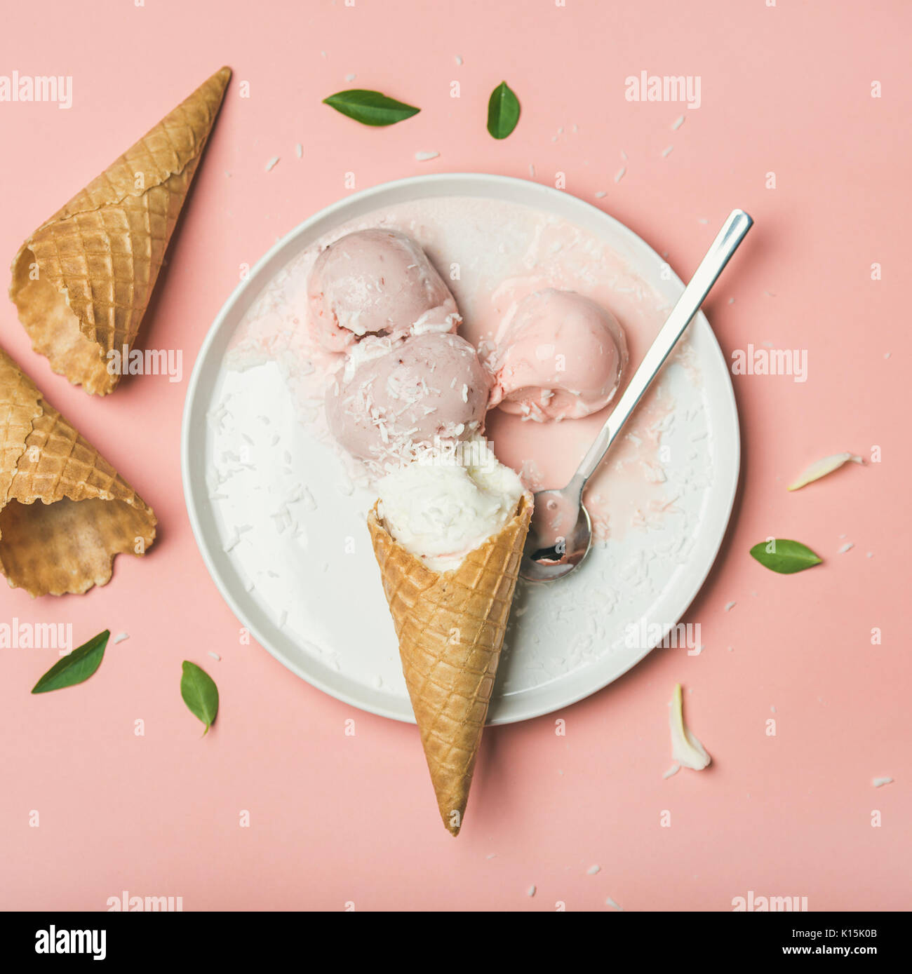 Flatlay of strawberry and coconut ice cream scoops, square crop Stock
