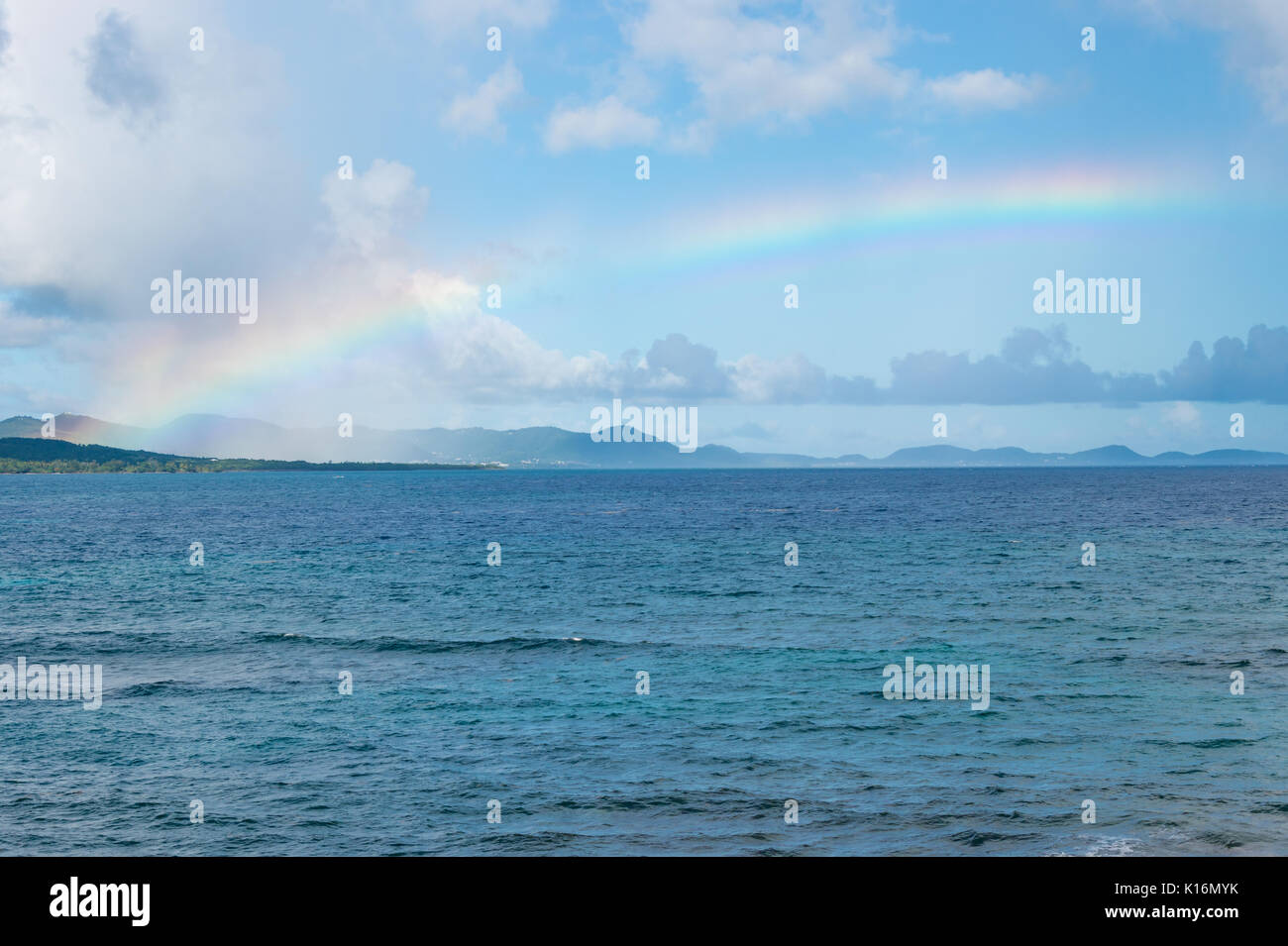 Landscape in Martinique with rainbow over the caribbean sea Stock Photo