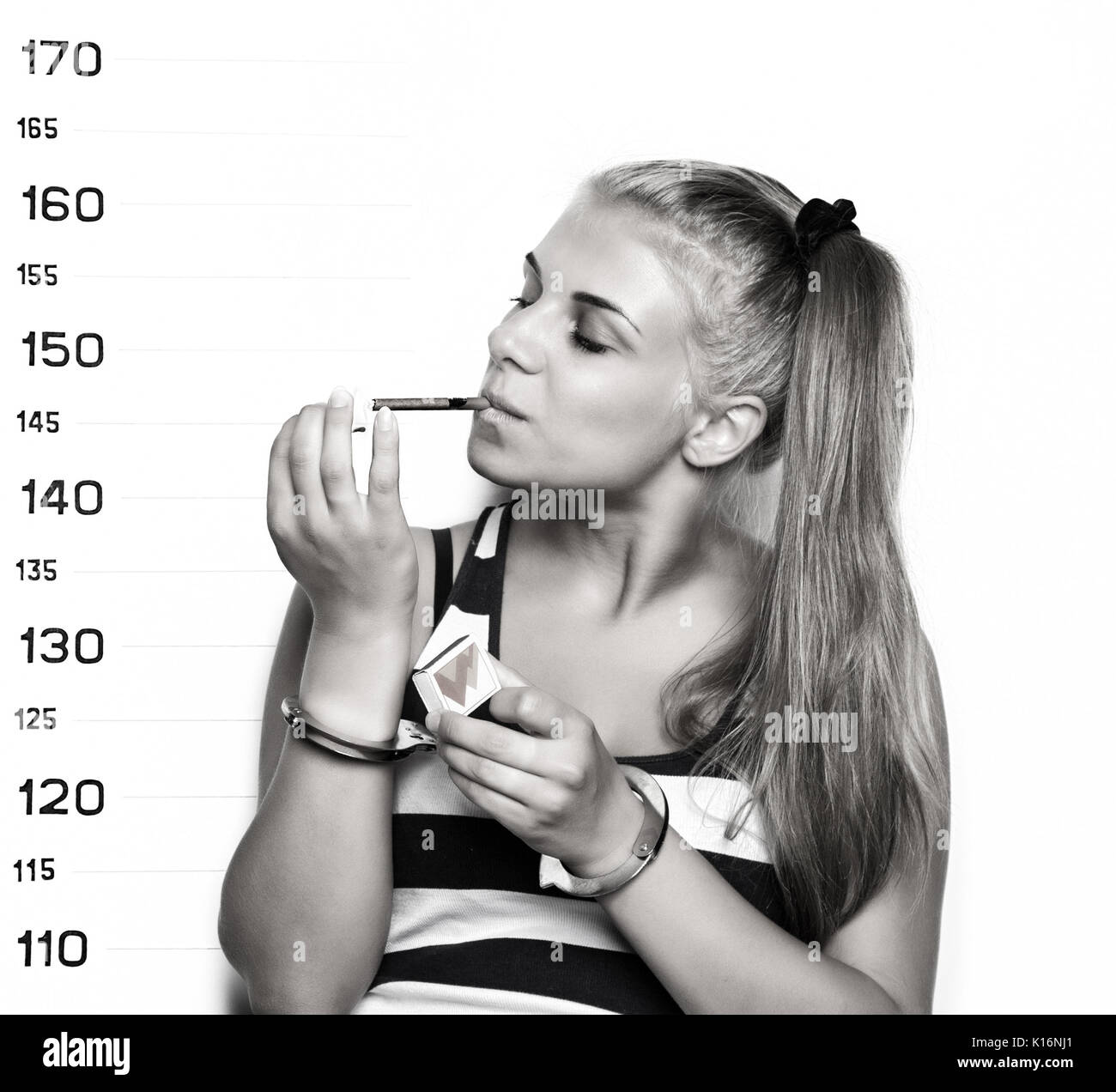 Young beautiful blonde woman with sigarette, Criminal Mug Shots Stock Photo