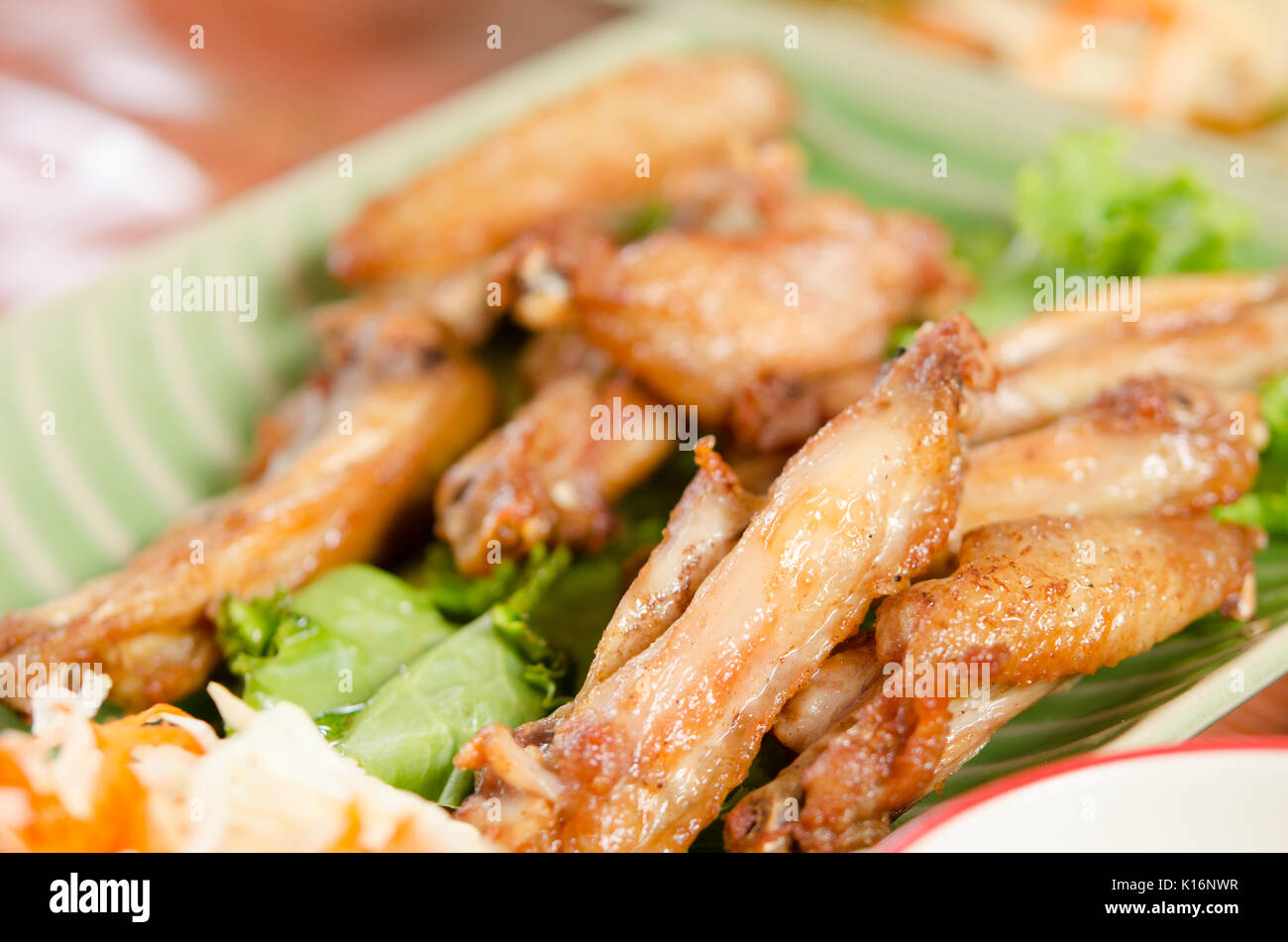 barbecue chicken wings  on dish shot with selective focus Stock Photo
