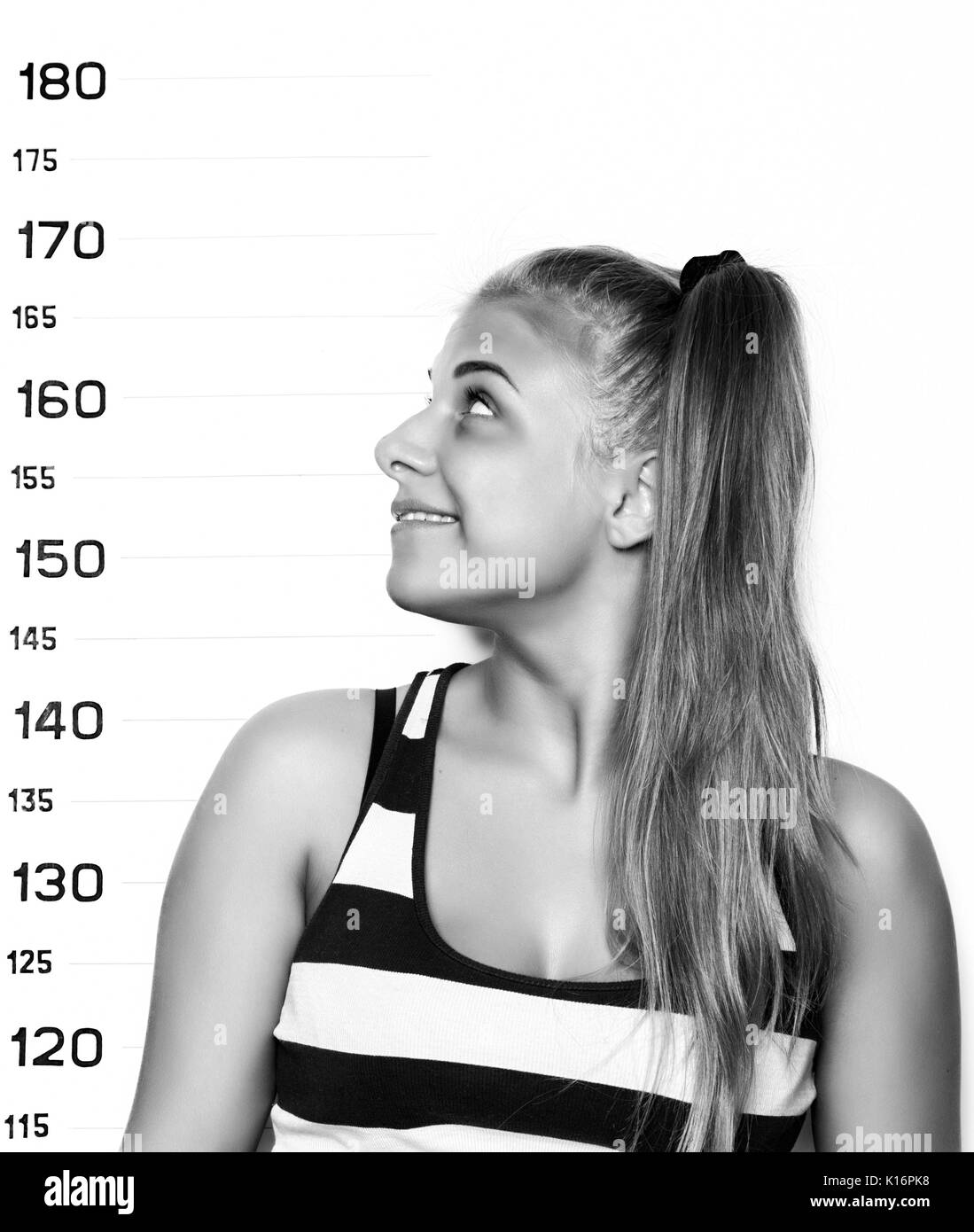 Young beautiful blonde woman Criminal Mug Shots. black and white Stock Photo