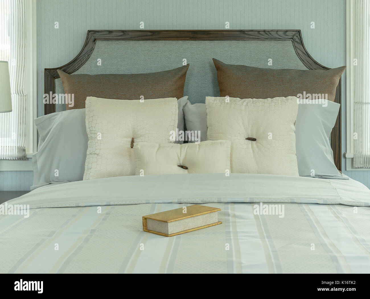 Cozy Bedroom Interior With White And Blue Pillows On Bed
