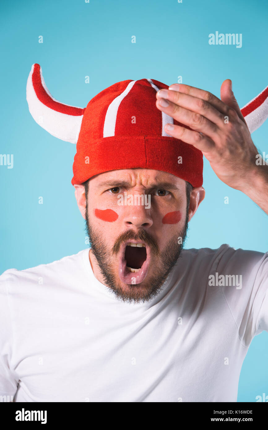 The football fan over blue Stock Photo