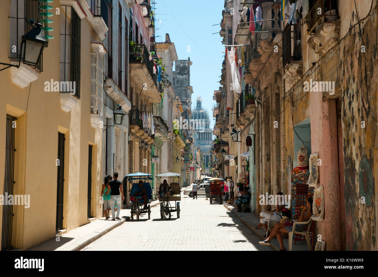 HAVANA, CUBA - June 7, 2015: Narrow residential & commercial street in the capital communist nation Stock Photo