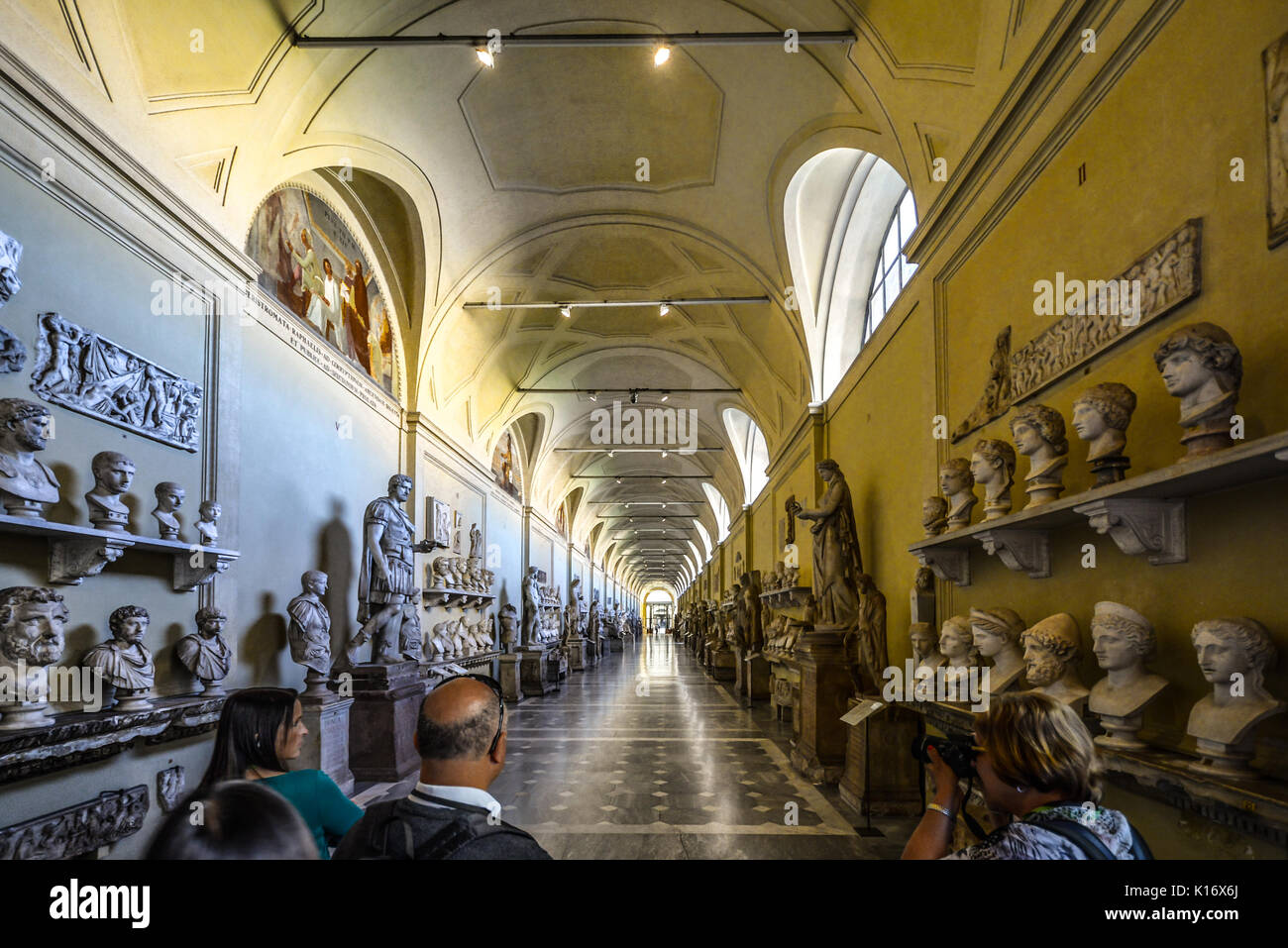 Inside the Vatican Museum and the long Hall of Statues featuring marble busts and ancient sculptures Stock Photo