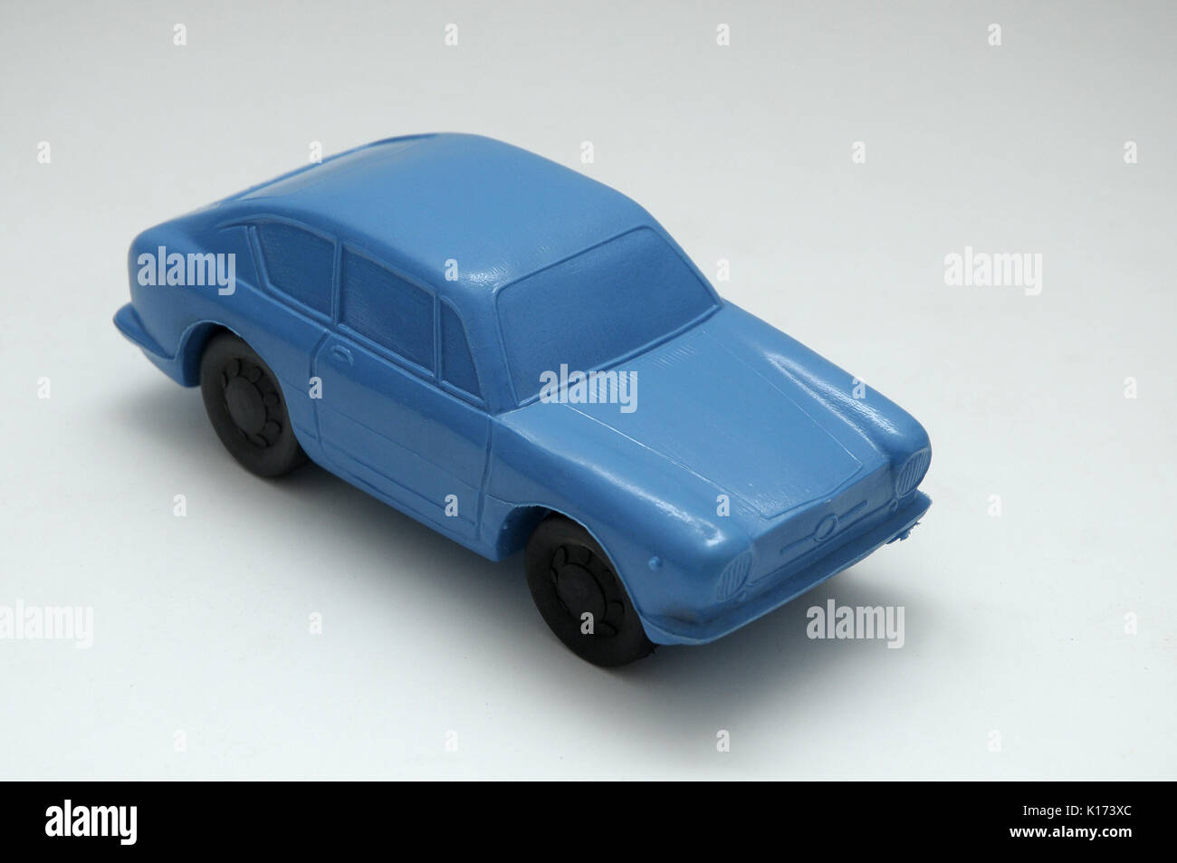 BLUE CAR MADE ON PLASTIC Synthetic material, obtained by carbon polymerization, which can be molded by pressure or heat Stock Photo