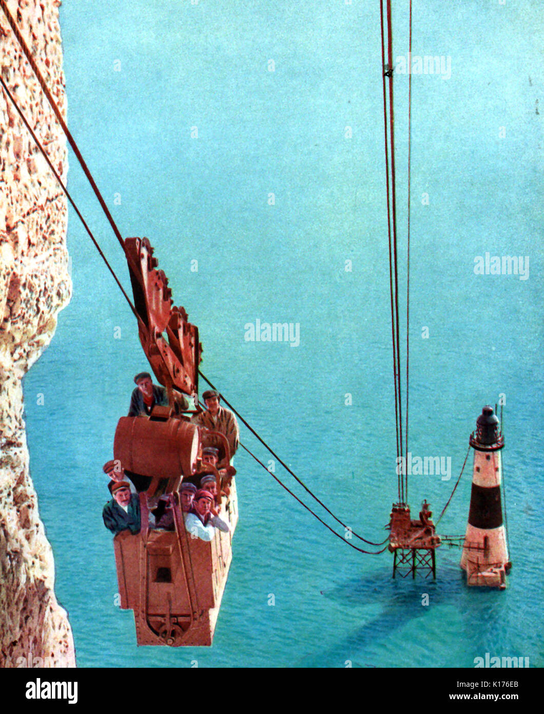 A  colourised 1930 illustration believed showing the construction crew on a cable car gondola during the building of Beachy Head Lighthouse in 1902 Stock Photo