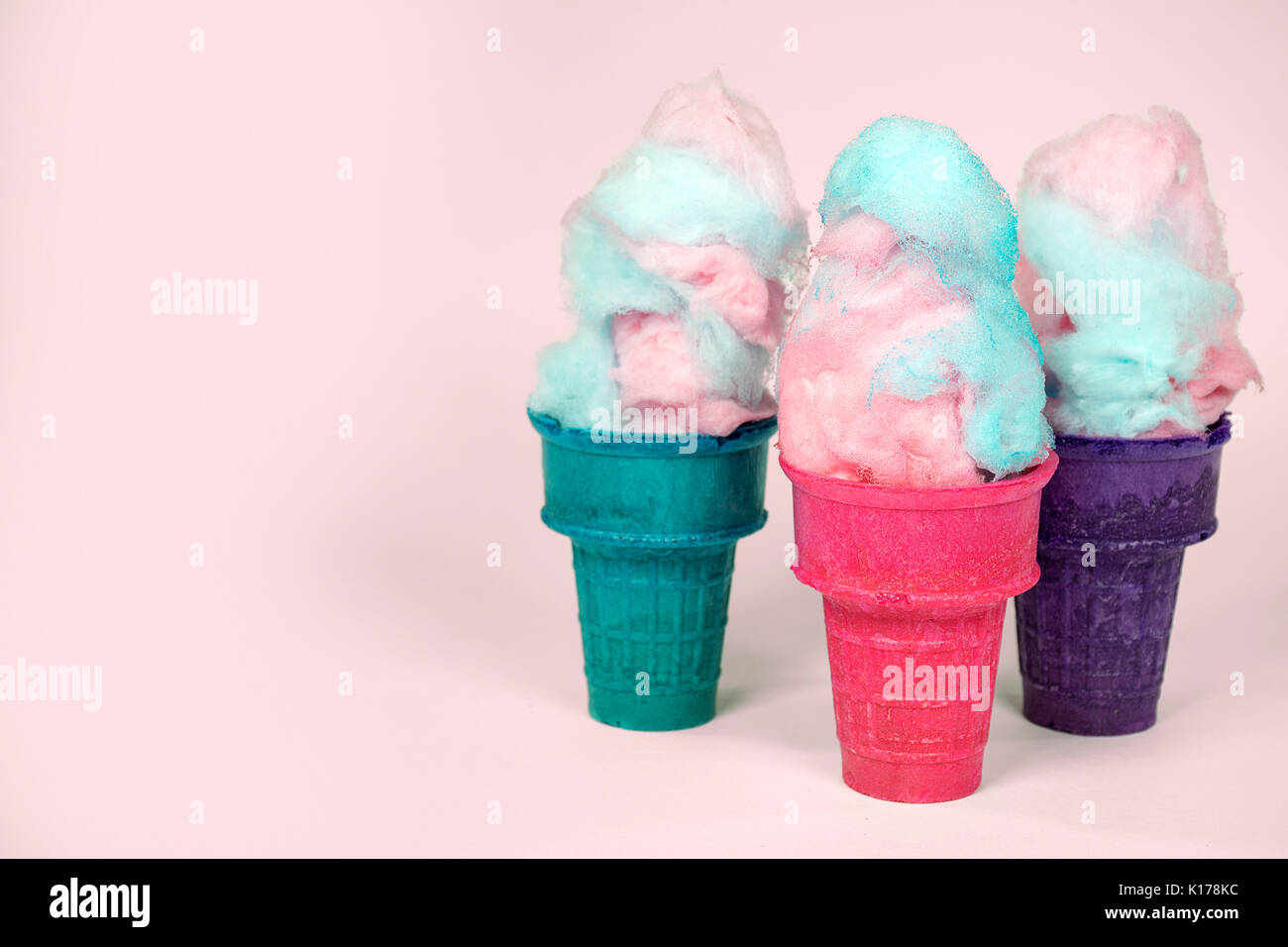 cotton candy in ice cream cones isolated on pastel pink background Stock  Photo - Alamy