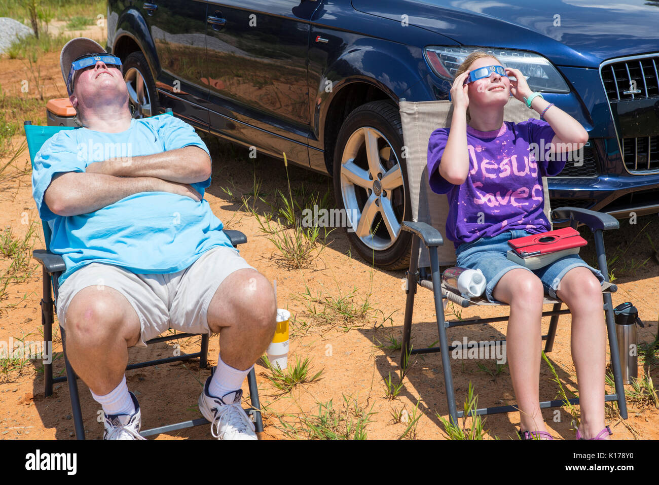 Observers wearing eclipse glasses watch the Great American Eclipse on August 21, 2017. Stock Photo