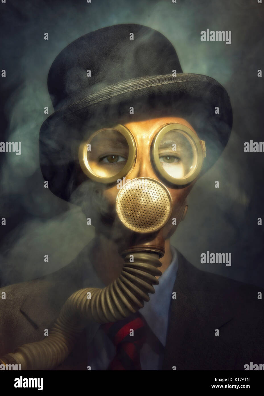 person in hat and suit wearing gas mask with smoke Stock Photo