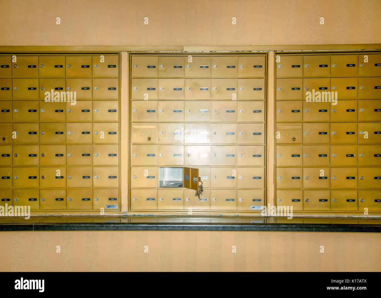 a row of  mailboxes in a large building Stock Photo