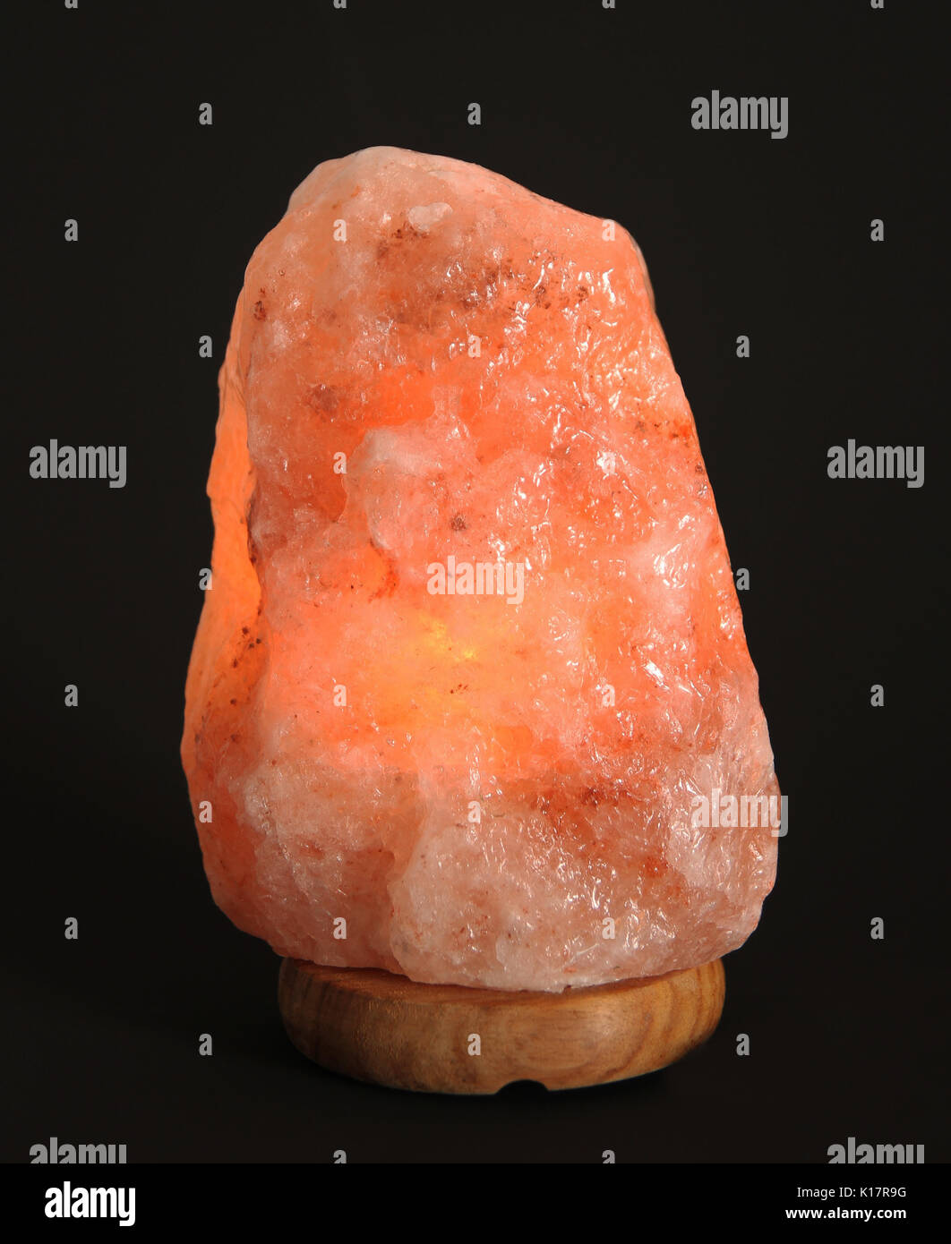 Himalayan salt lamp  on black background Stock Photo