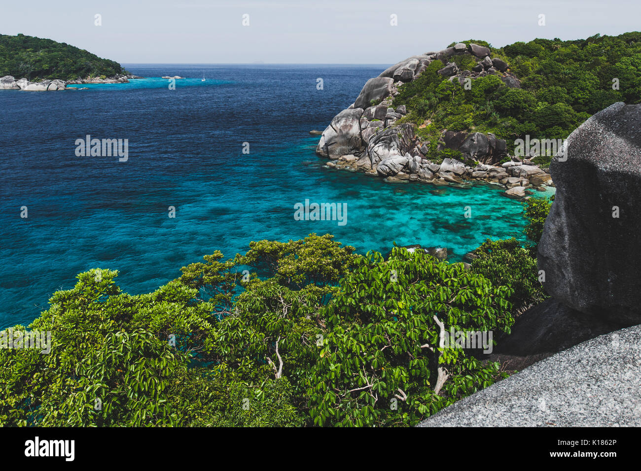 Rocky coast of paradise island with transparent crystal and clear water. Vacation in Similan Stock Photo