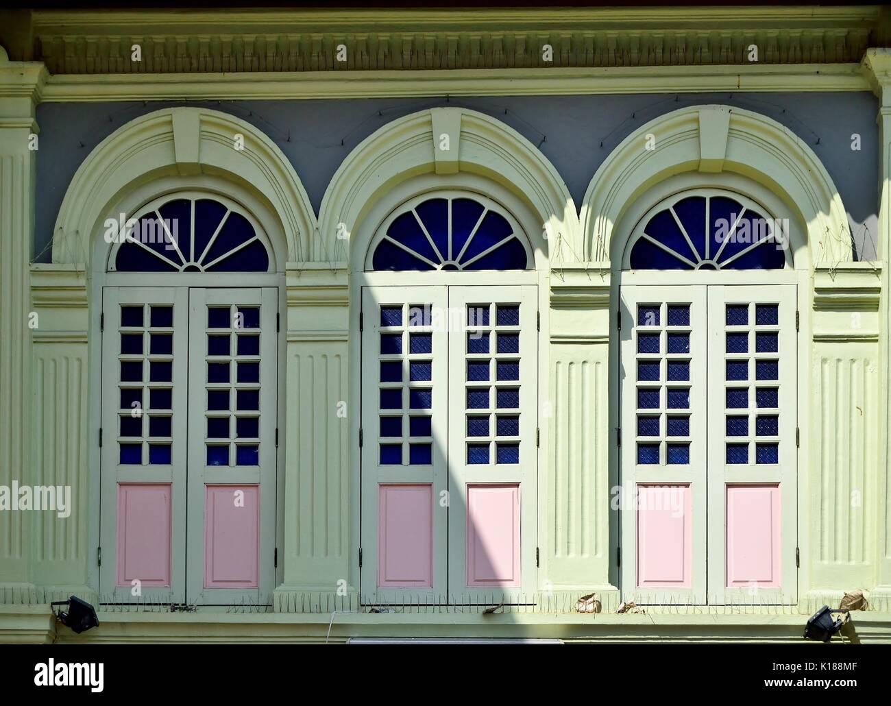 Traditional Shop House Exterior With Green Wooden Louvered