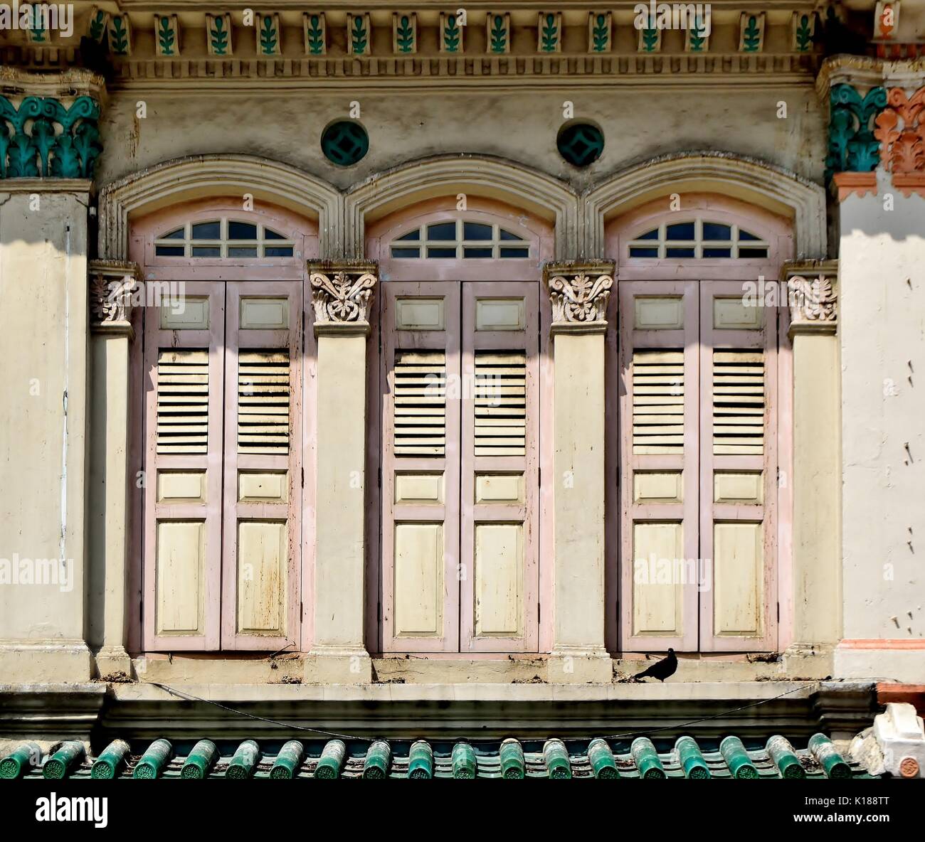 Traditional shop house exterior with pink wooden louvered shutters ... Traditional shop house exterior with pink wooden louvered shutters ...