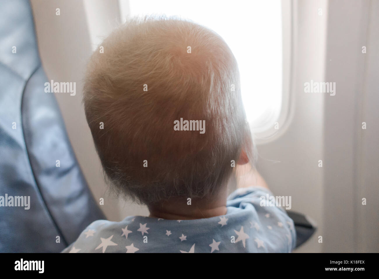 Baby on seat in airplane Stock Photo Alamy