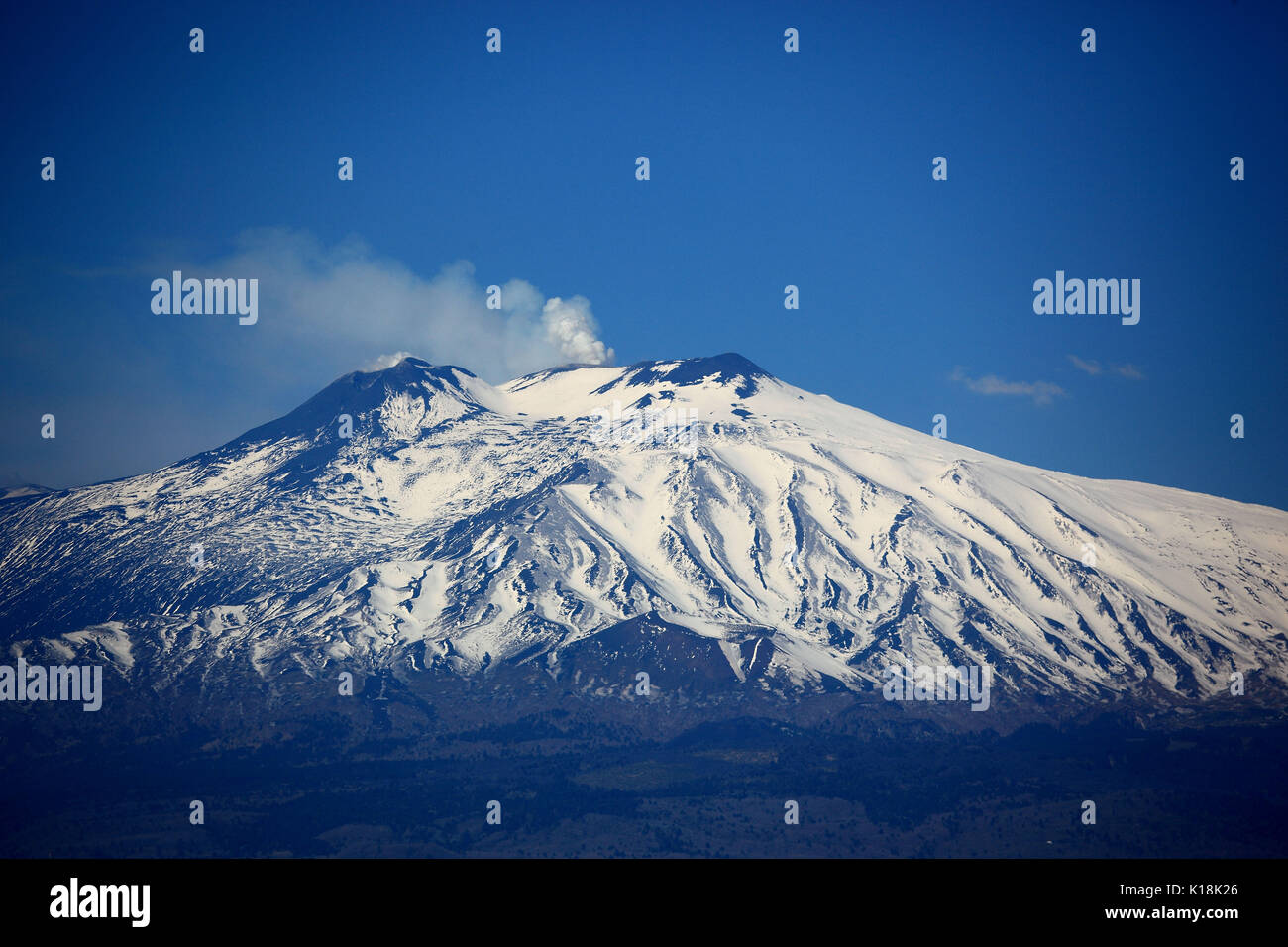 Sicily, the snow-capped peak of volcano Etna Stock Photo