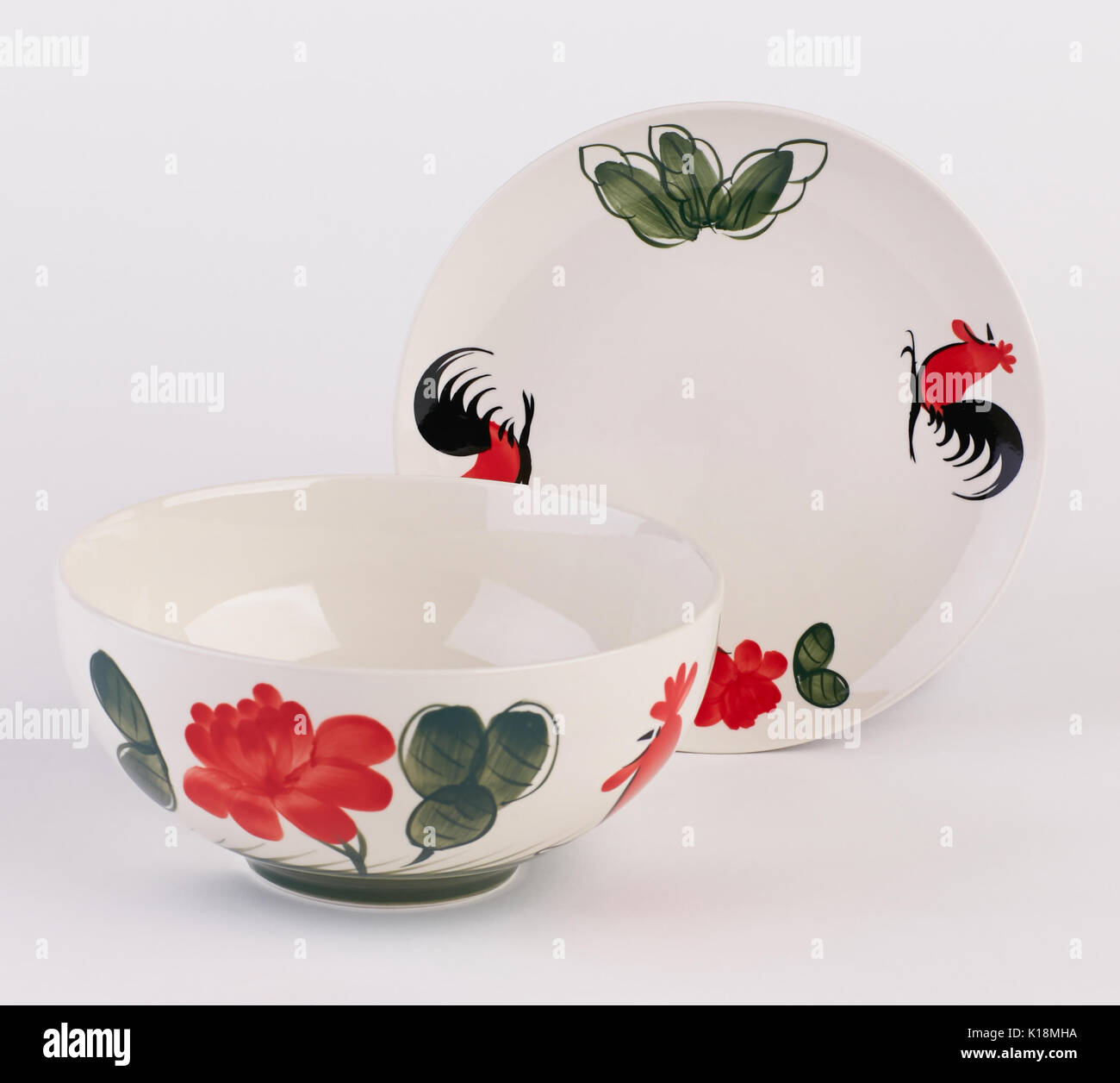Hand painted ceramic soup bowl and dish isolated on white background Stock Photo