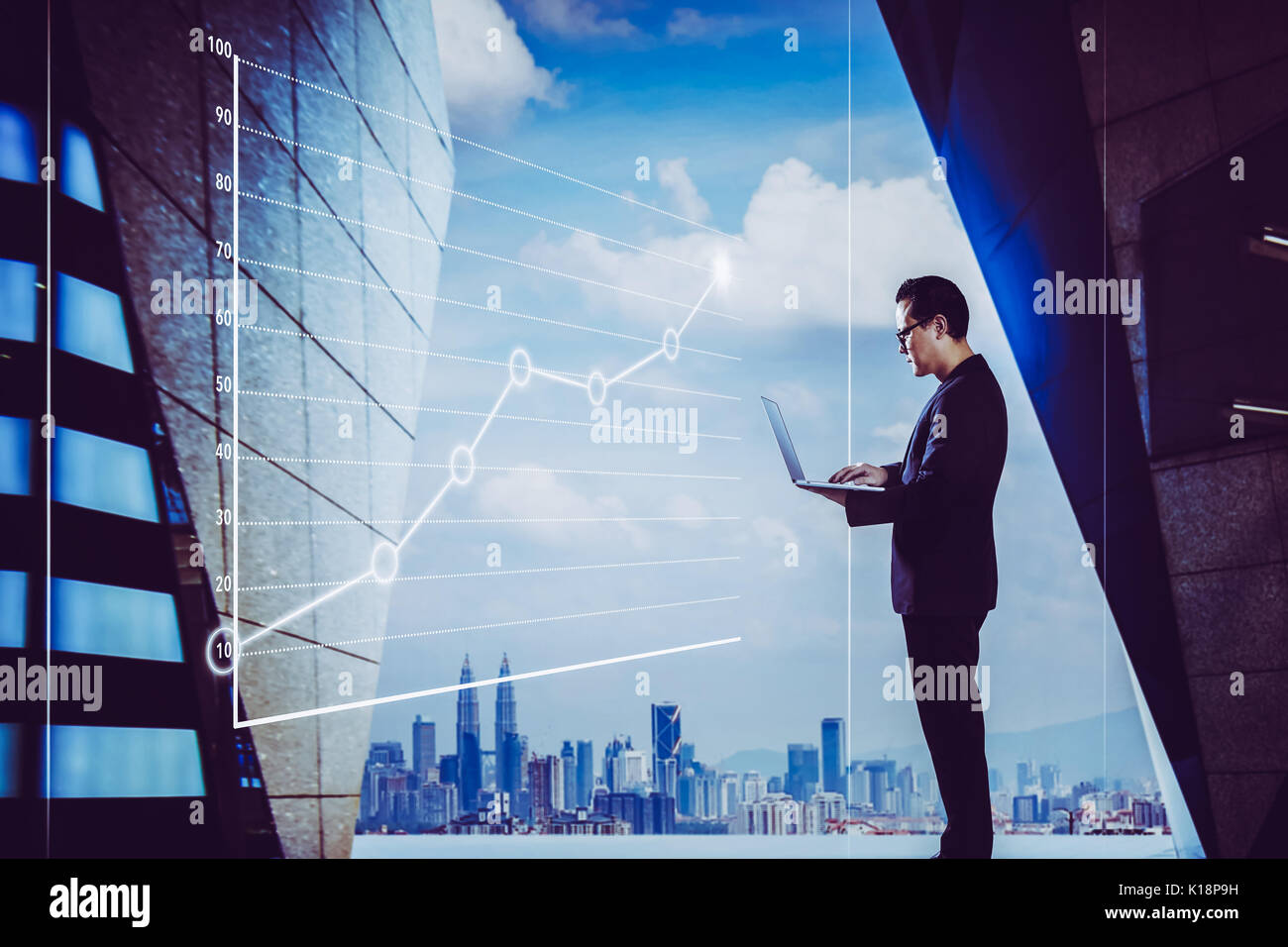 Businessman using laptop with graph statistical analysis ,Business success concept. Stock Photo