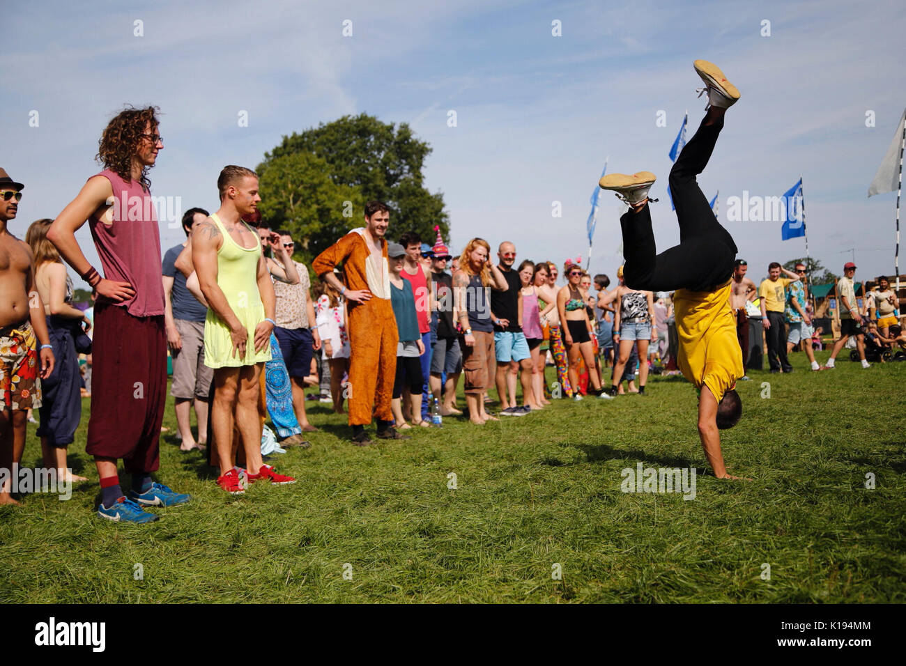 Northampton, UK. 25th Aug, 2017. Shambala festival, Northampton officially kicks off today with an early morning limbo and capoeira workshop under sunny skies. Festival goers shake off last nights hangovers and attempt cartwheels, dancing and singing in the Kelmarsh Estate. Credit: Wayne Farrell/Alamy Live News Stock Photo