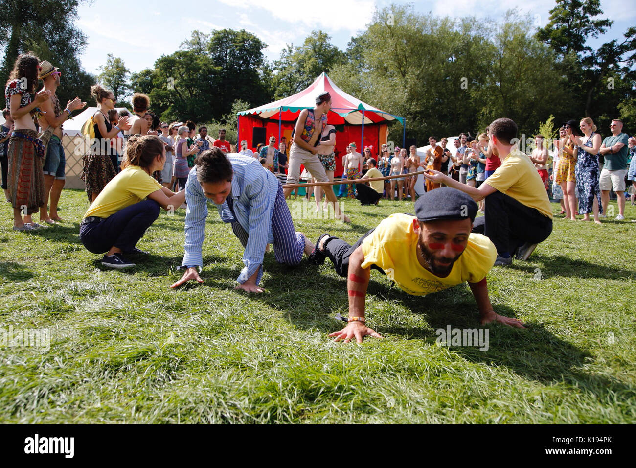 Northampton, UK. 25th Aug, 2017. Shambala festival, Northampton officially kicks off today with an early morning limbo and capoeira workshop under sunny skies. Festival goers shake off last nights hangovers and attempt cartwheels, dancing and singing in the Kelmarsh Estate. Credit: Wayne Farrell/Alamy Live News Stock Photo