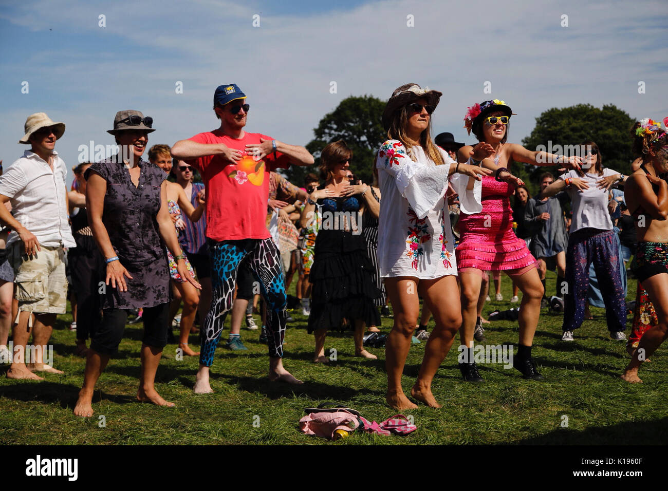 Northampton, UK. 25th August, 2017. Festival goers join together for a giant Charleston dance workshop. The alternative festival famed for authentic music, crazy fancy dress and enthusiastic energy continues today under sunny skies on the Kelmarsh Estate. Credit: Wayne Farrell/Alamy Live News Stock Photo