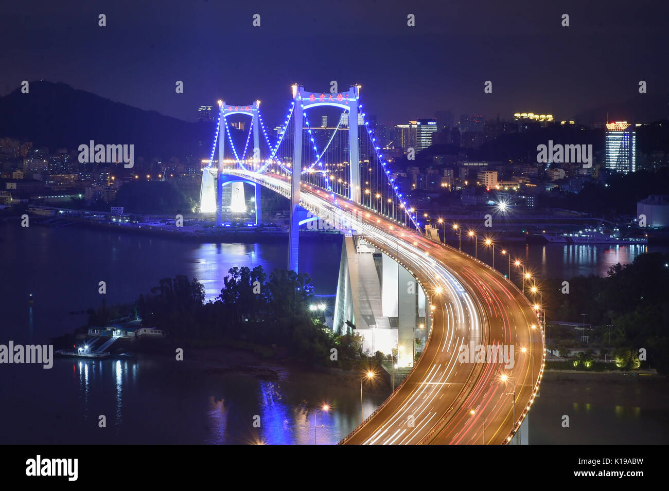 Xiamen. 25th Aug, 2017. Photo taken on Aug. 25, 2017 shows the lighting at the Haicang Bridge in Xiamen, southeast China's Fujian Province. Landscape lighting of four cross-sea bridges and an undersea tunnel linking Xiamen Island and the mainland in Fujian Province were lit up to greet the upcoming BRICS summit. Credit: Song Weiwei/Xinhua/Alamy Live News Stock Photo