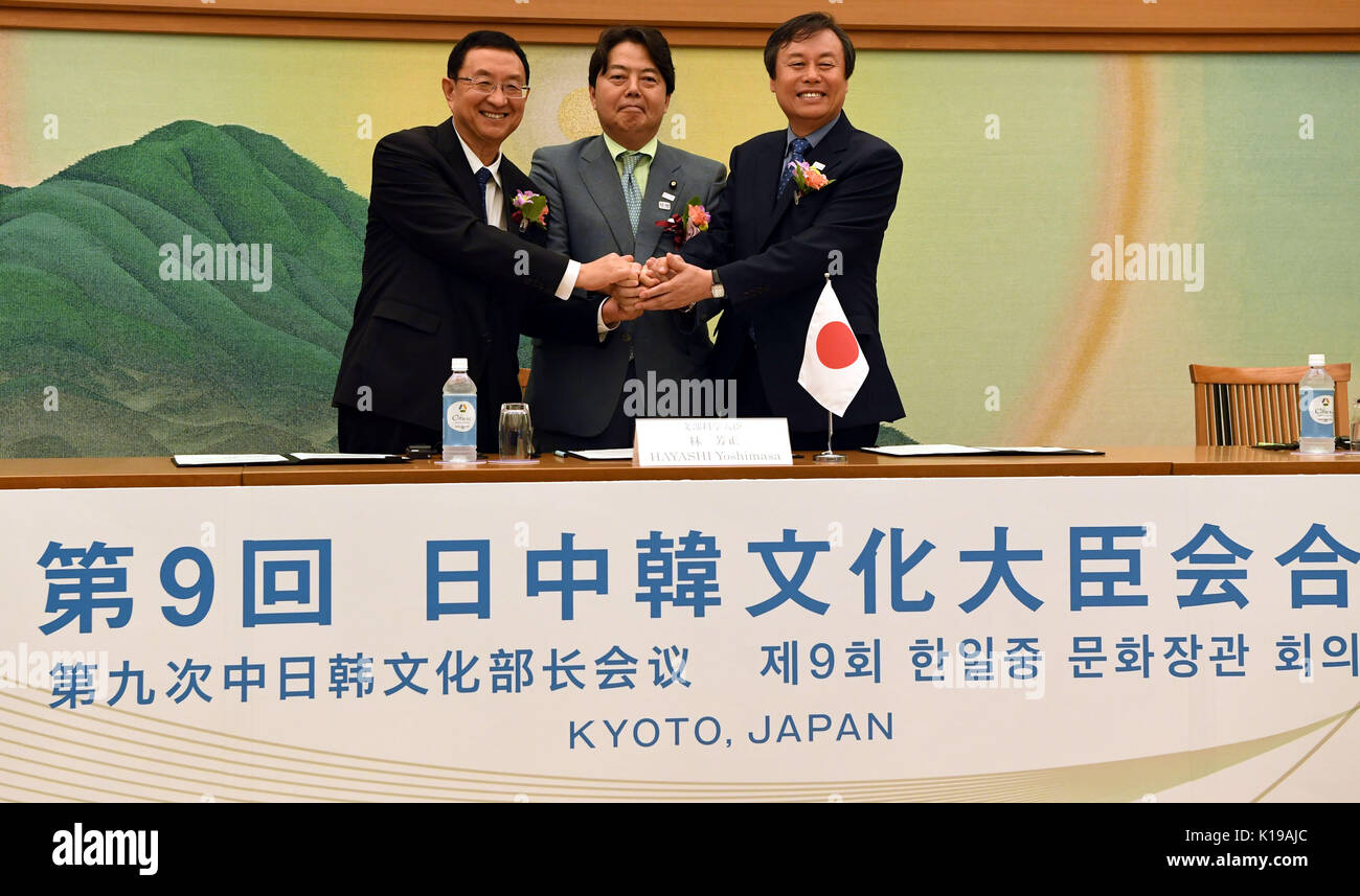(170826) -- KYOTO, Aug. 26, 2017 (Xinhua) -- Chinese Minister of Culture Luo Shugang (L) poses for photos with his Japanese and South Korean counterparts Yoshimasa Hayashi (C) and Do Jong-whan in Kyoto, Japan, on Aug. 26, 2017. Culture ministers of China, Japan, and the Republic of Korea (ROK) exchanged views on further enhancing practical cooperation in cultural areas at the ninth China-Japan-ROK Cultural Ministers' Meeting held here Saturday. (Xinhua/Ma Ping) (zy) Stock Photo