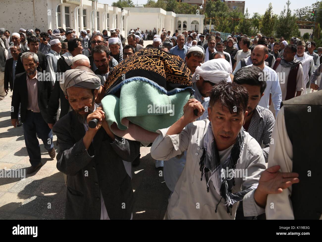 (170826) -- KABUL, Aug. 26, 2017 (Xinhua) -- Mourners carry the coffin of a victim of the recent terrorist attack on a Shiite Mosque during a funeral in Kabul, capital of Afghanistan, Aug. 26, 2017. At least 40 were killed while 90 others were wounded at the mosque on Friday in Kabul. (Xinhua/Rahmat Alizadah) (swt) Stock Photo
