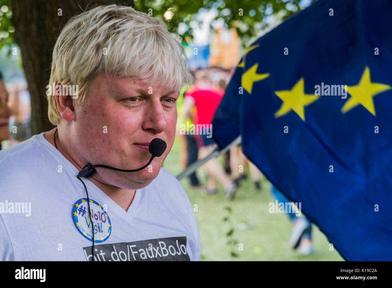 London, UK. 26th Aug, 2017. Anti brexit campaigners with an effigy of Theresa May and a Boris Johnson Look alike give out stickers - Crowds queue for the SW4 dance festival on Clapham Common on a sunny bank holiday afternoon. Credit: Guy Bell/Alamy Live News Stock Photo