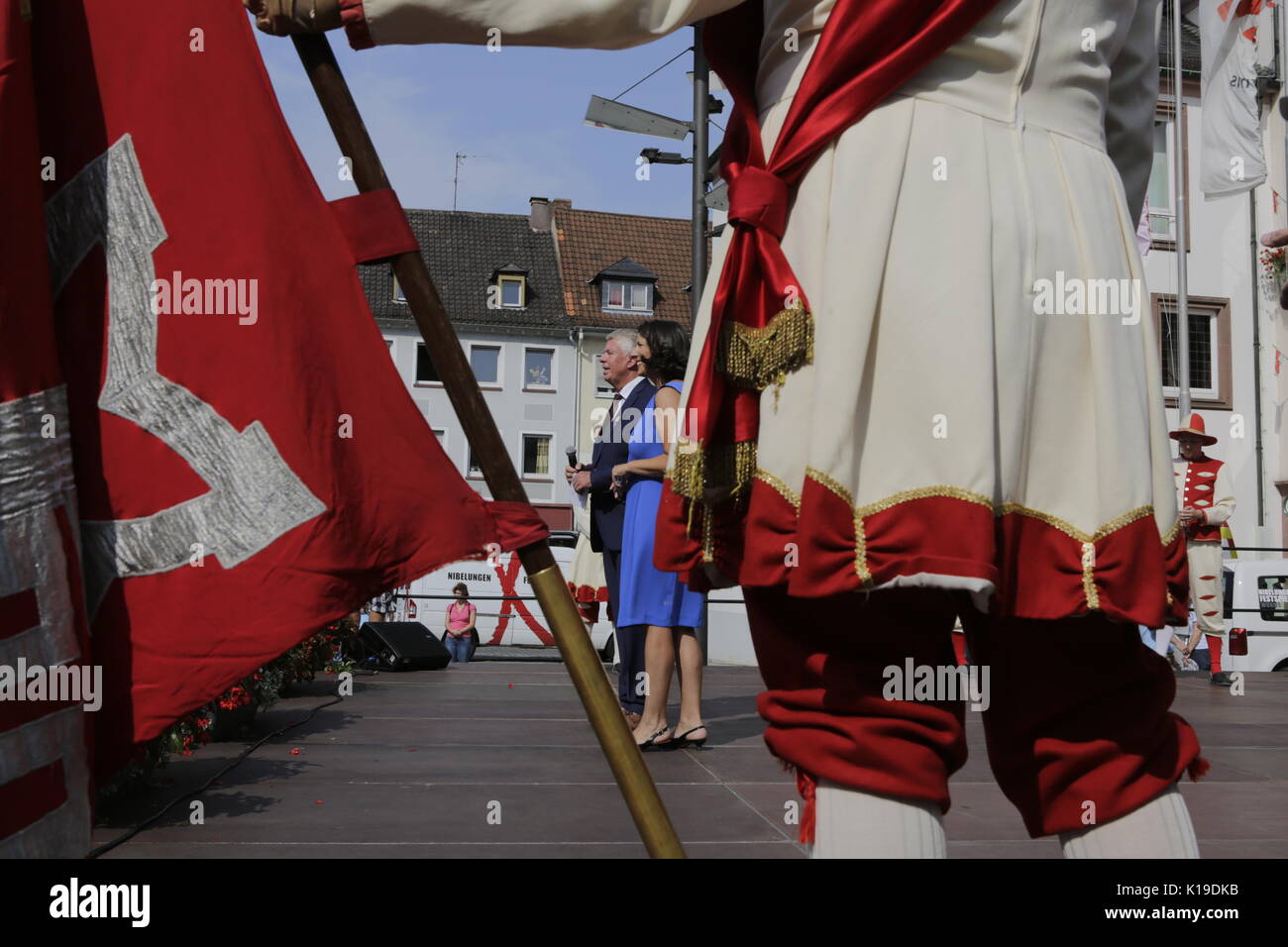 Worms, Germany. 26th August 2017. The Lord Mayor of Worms, Michael Kissel, addresses the audience. Daniela Schmitt stands next to him. The largest wine and funfair along the Rhine, the Backfischfest started in Worms with the traditional handing over of power from the Lord Mayor to the mayor of the fishermenÕs lea. The ceremony was framed by dances and music. Secretary of state Daniela Schmitt from the Rhineland-Palatinate ministry for economy, transport, agriculture and viticulture attended the opening Credit: Michael Debets/Alamy Live News Stock Photo