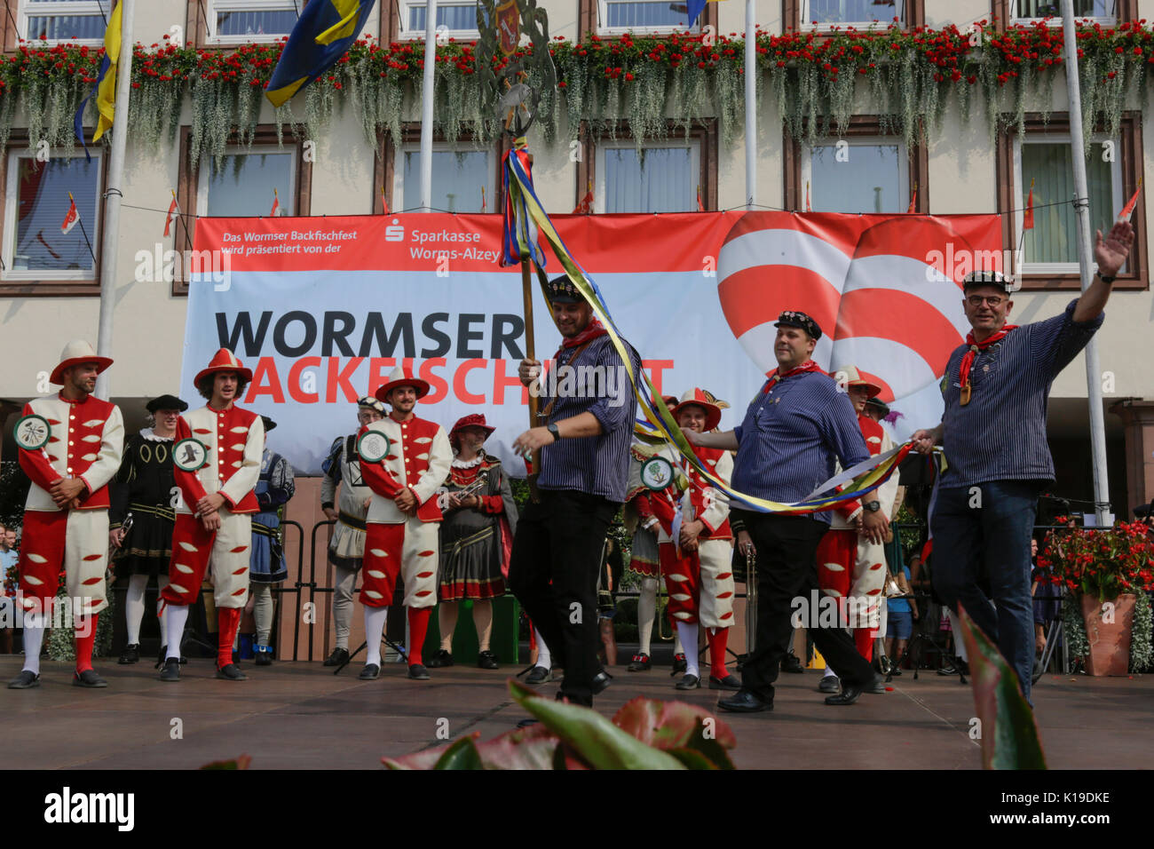 Worms, Germany. 26th August 2017. The representatives of the old fishermen's Guild of Worms come onto the stage. The largest wine and funfair along the Rhine, the Backfischfest started in Worms with the traditional handing over of power from the Lord Mayor to the mayor of the fishermen’s lea. The ceremony was framed by dances and music. Secretary of state Daniela Schmitt from the Rhineland-Palatinate ministry for economy, transport, agriculture and viticulture attended the opening Credit: Michael Debets/Alamy Live News Stock Photo