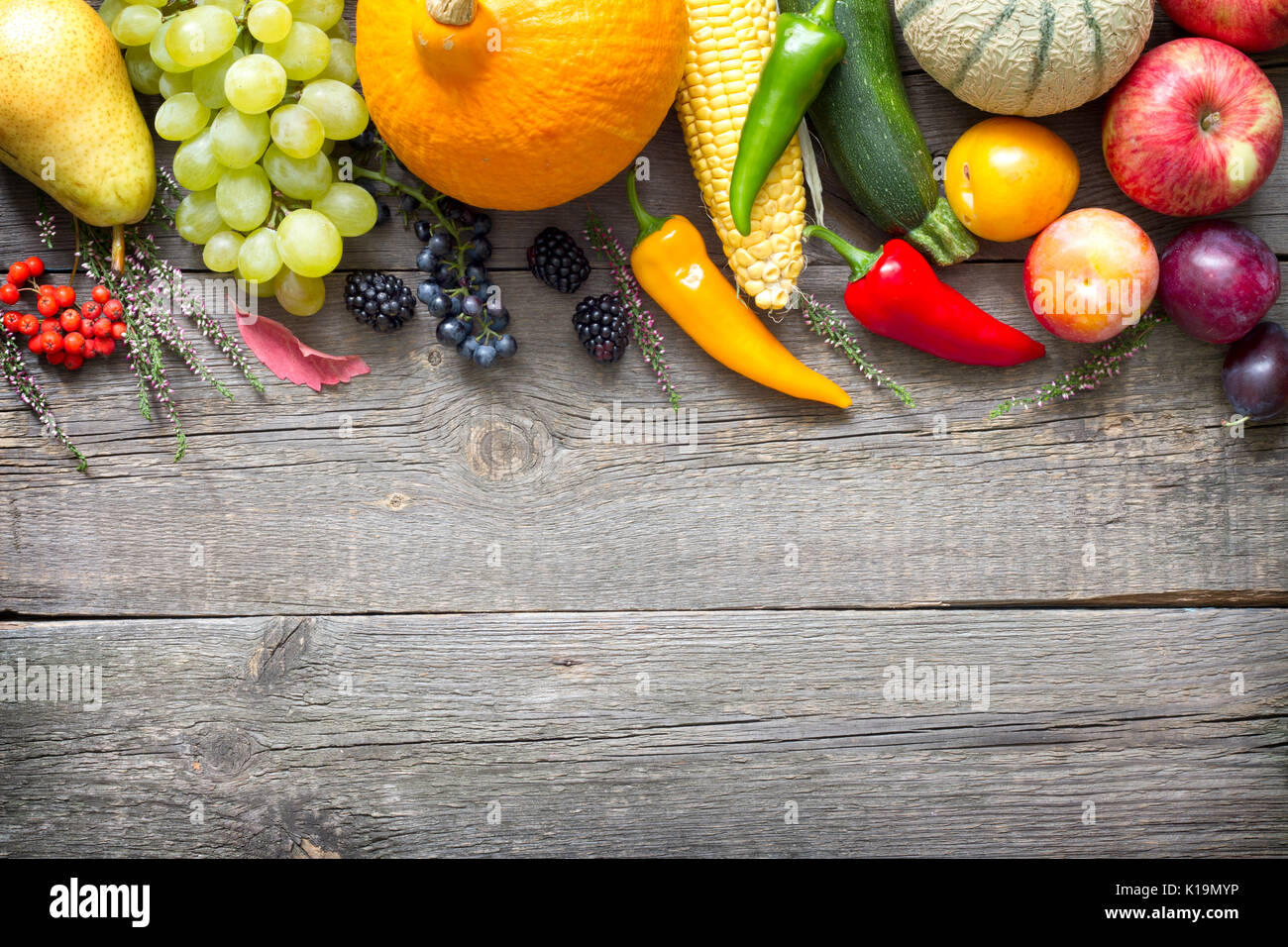 Autumn fruits and vegetables Still life on old wooden boards abstract ...