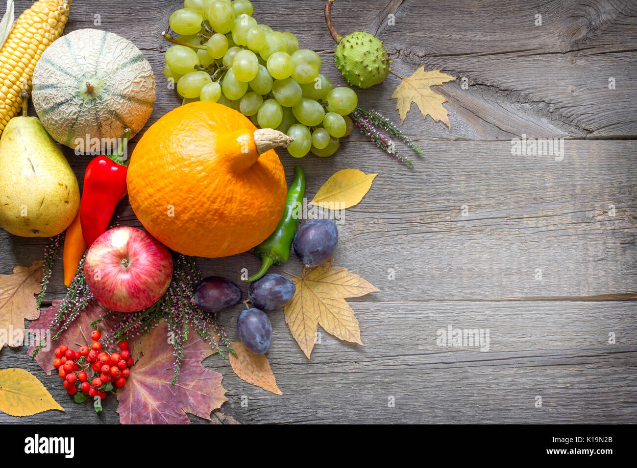Autumn fruits and vegetables Still life on old wooden boards abstract ...