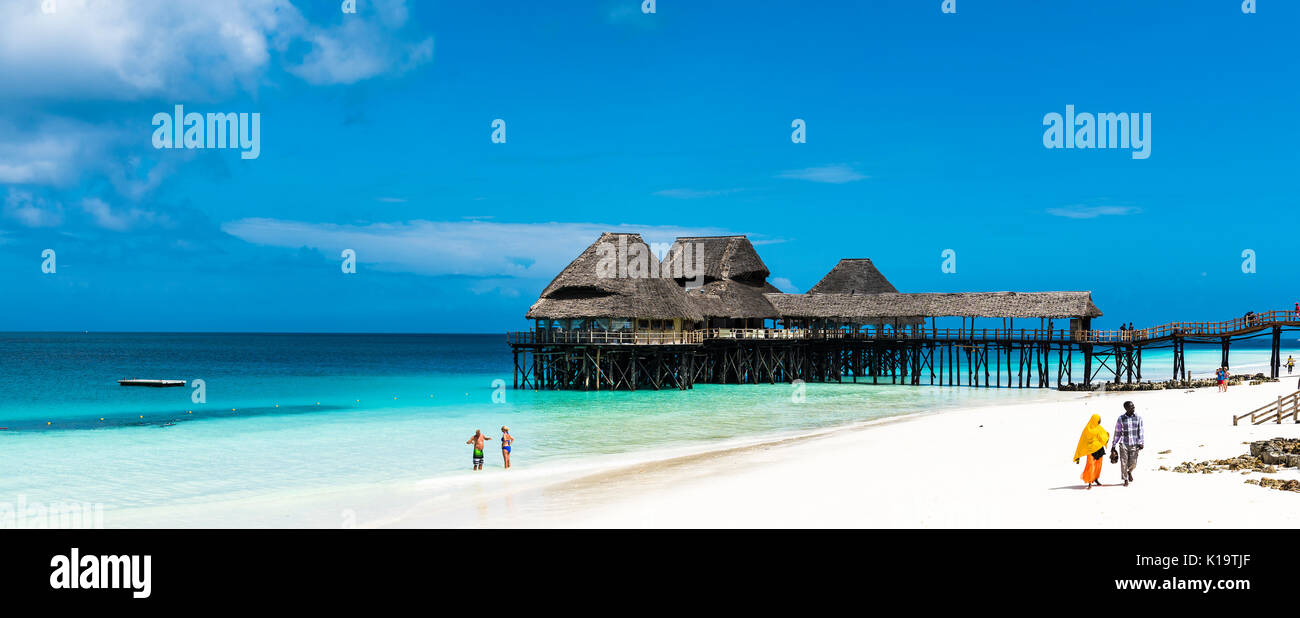 A stunning beach in Zanzibar over the beautiful blue waters of the Indian ocean. Zanzibar is an Island just off the coast of Tanzania, Africa Stock Photo