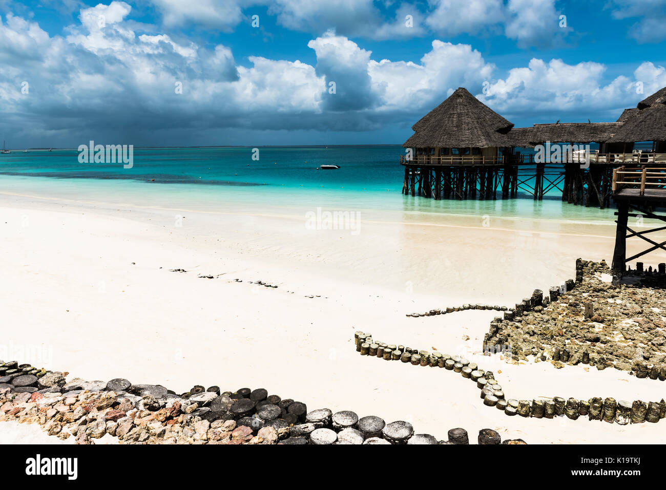 Beautiful Beach by the blue waters of the Indian ocean in Zanzibar. Zanzibar is an Island just off the coast of Tanzania - Africa. Stock Photo