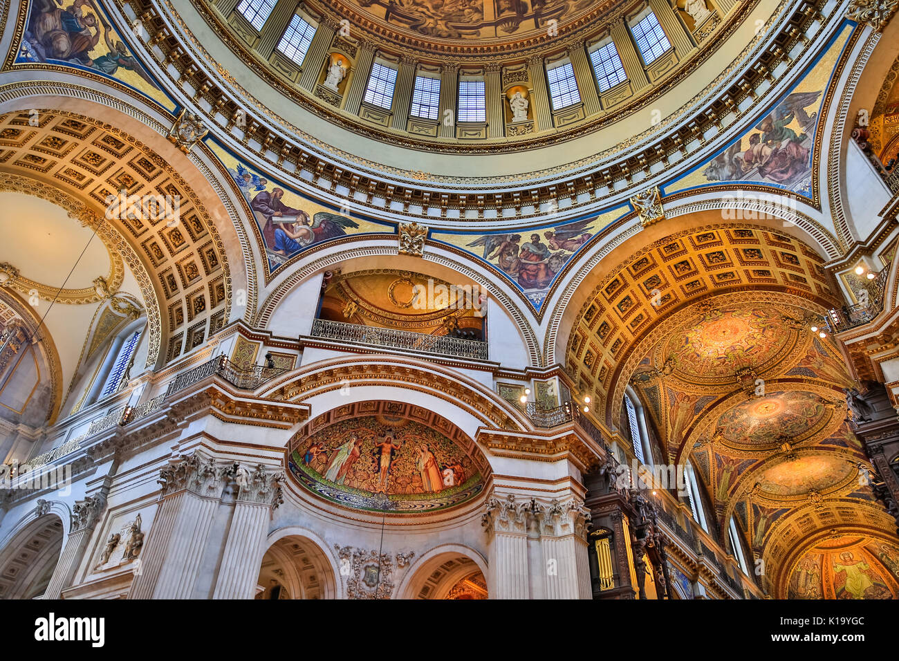 St Paul's Cathedral interior, view up to the ceiling and wall paintings, carvings and gilded decorations of the inner dome, London UK Stock Photo
