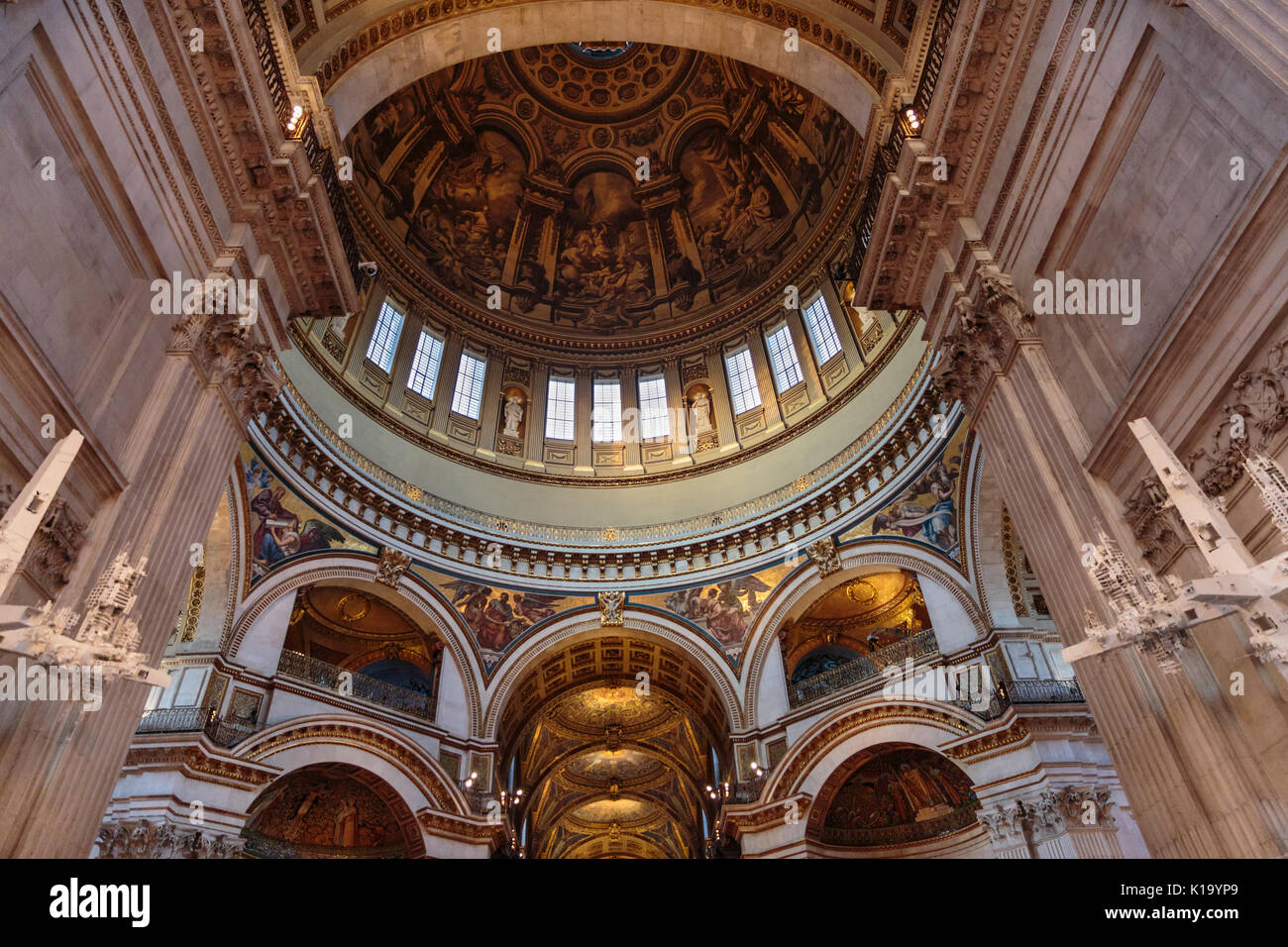 St Paul's Cathedral interior, view up to ceiling murals, paintings, mosaics and gilded decorations, inner dome, London, England Stock Photo