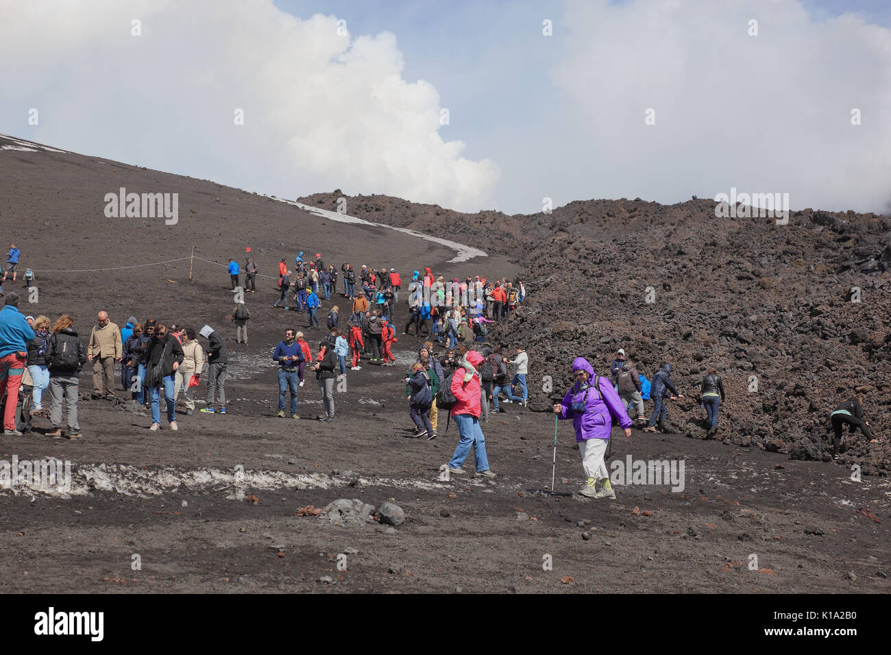 Sicily, tourist group in the volcano landscape at Etna Stock Photo