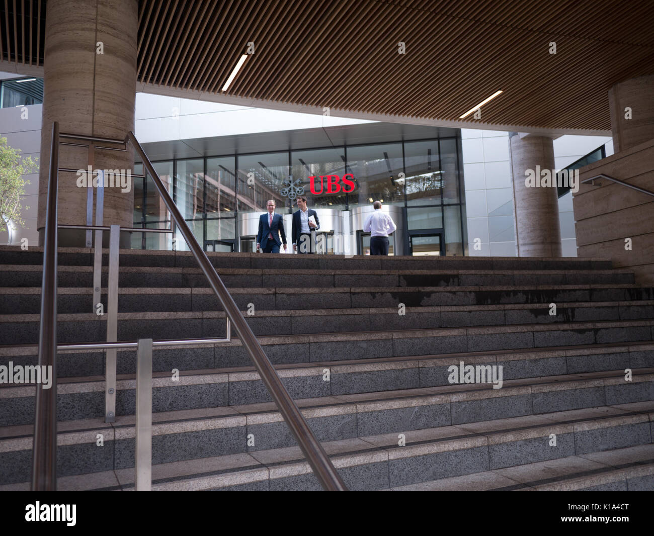 Pedestrians and office workers walk past, UBS headquarters, Broadgate, London Stock Photo